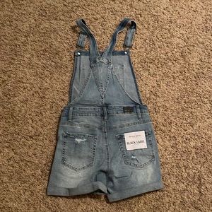 Boutique distressed denim overalls. Size small. New with tags.